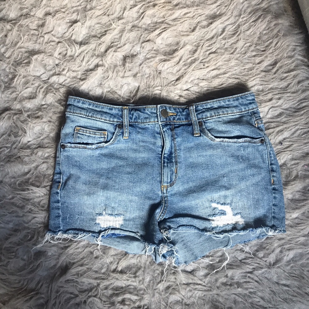 Medium wash ripped high waisted shorts